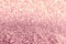 Texture of rose gold glitter fabric as background, closeup