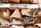 Texture of a rustic woodpile with firewood