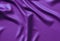 Texture satin. silk background. shiny wavy pattern canvas. color fabric, cloth purple.