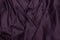 Texture satin. silk background. shiny wavy pattern canvas. color fabric, cloth purple