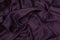 Texture satin. silk background. shiny wavy pattern canvas. color fabric, cloth purple