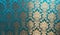 The texture of silk with a floral pattern. Chinese silk brocade, beautiful expensive fabric background. Gold ornament turquoise em