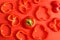 Texture of sliced red peppers on a red background