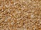 Texture of small sawdust in brown color. Artistic object. Designer material.