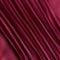 Texture of a smooth luxurious, elegant fabric in burgundy, purple, red. Purple satin or silk fabric with folds and waves. eps 10