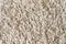 The texture of a soft, fleecy, light-colored floor rug