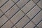 Texture of stack bond brick-like gray concrete pavement