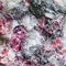 Texture of stone with pink Eudialyte crystals