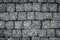 The texture of stone walkway. Cement brick squared stone floor background. Concrete paving slabs