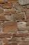 Texture of stone wall, background of old rough masonry from natural stones, medieval wall of castle or fortress