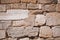 The texture of the stone wall. Limestone. Coquina. Old wall. Background