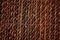 Texture straw design wicker brown rug. Close