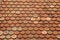 Texture on terracotta roof tiles over an Italian mountain Castel in Val Gardena
