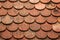 Texture on terracotta roof tiles over an Italian mountain Castel in Val Gardena