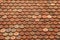 Texture on terracotta roof tiles over an Italian mountain Castel in Val Gardena