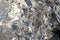 Texture of a thin crumpled sheet of foil. Crumpled foil background. Stock photo foil. Silver chrome color