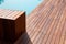 Texture with tiled wooden decorative planking, hardwood ipe pool deck on direct sun heat