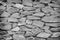 Texture uneven of gray large and small stone wall patterns background