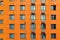 Texture unusual abstract orange house with windows