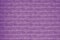 Texture of a violet brick wall. Brick background bright purple. Purple brick wall pattern. Interior detail. Design background. Emp