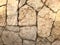 The texture of the wall is made of beautiful smooth natural old old shrewded yellow densely laid out without gaps of stones, cobbl