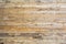 The texture of the wall made of wooden planks located horizontally, the surface of the wood is poorly treated, many wood fibers an