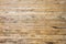 The texture of the wall made of wooden planks located horizontally, the surface of the wood is poorly treated, many wood fibers an