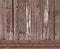 The texture of weathered wooden wall. Aged wooden plank fence of vertical flat board