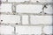 Texture of white brick wall with cement mortar. Background of white silicate brick in the form of brick masonry of rectangular and