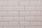 Texture of white brick wall made from vinyl panels background