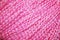 Texture of wide pink threads close-up