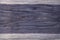 The texture of a wooden board painted in purple. Empty background