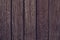 Texture of wooden boards from red tree. Pattern of redwood. Rustic wooden table of alder. Vintage maroon timber texture background