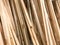 Texture of wooden brown diagonally tilted natural building boards sticks with knots. The background