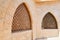 Texture of a wooden brown old man of an ancient beautiful carved textured Arab Islamic Islamic triangular window with ornaments an