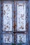 Texture of a wooden door. A wooden door with peeling paint. The old paint will climb from the old wooden door. Texture of wood