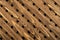 Texture of the wooden lattice. Natural wooden diagonal lattice. Close-up