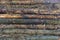 The texture of wooden logs. The wall of the shed.