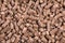 Texture of woody clumps, pellets of  litter, for cat, rabbit, guinea pig, hamster, rodent, bird, turtle and other pets