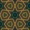 Textured African fabric. Abstract narcissus flower. Golden yellow, orange, green and black colors