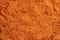 Textured background made of sea buckthorn powder