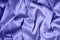 Textured background of purple silk or satin. Color of the Year 2022