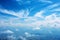 Textured blue sky background with wispy, cloud like patterns