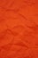 Textured crumpled red paper background. Copyspace