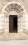 Textured door with stone arch