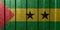 Textured flag of the Sao Tome and Principe on metal wall. Colorful natural abstract geometric background with lines