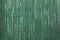 Textured green wooden background with planks