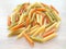 Textured Italian food background - uncooked penne pasta