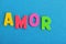 Textured letters write word amor