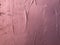 Textured magenta colored plaster. Wall stucco texture. Plastered background